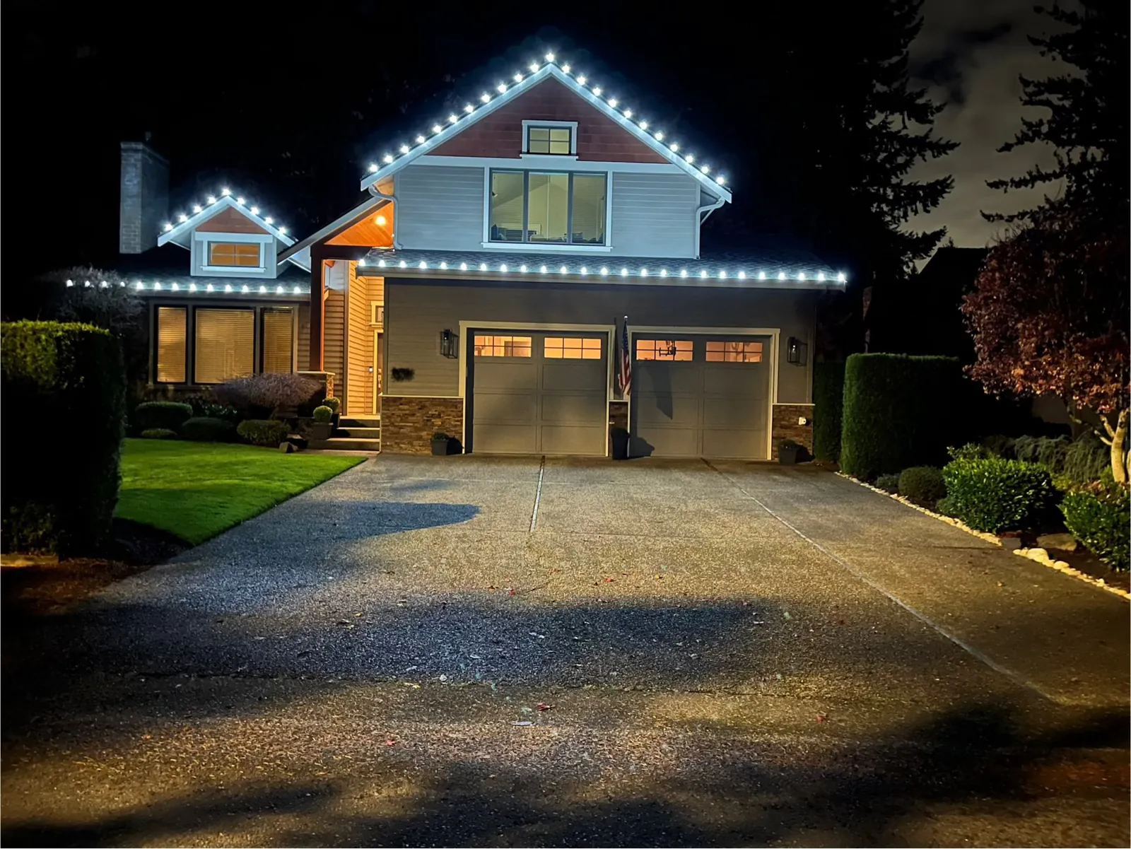 Holiday lighting detail along a gable edge